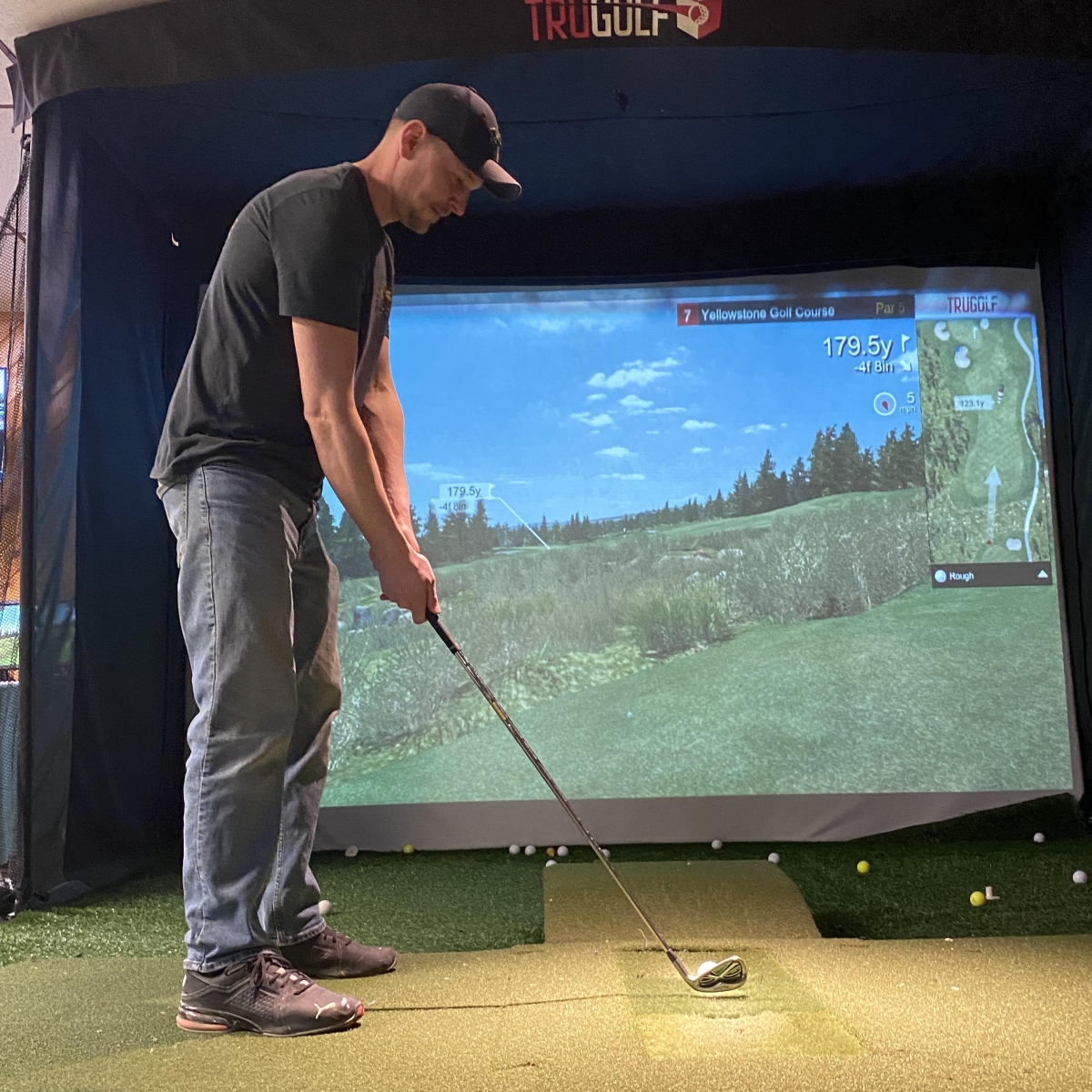 Golfer using the golf simulator